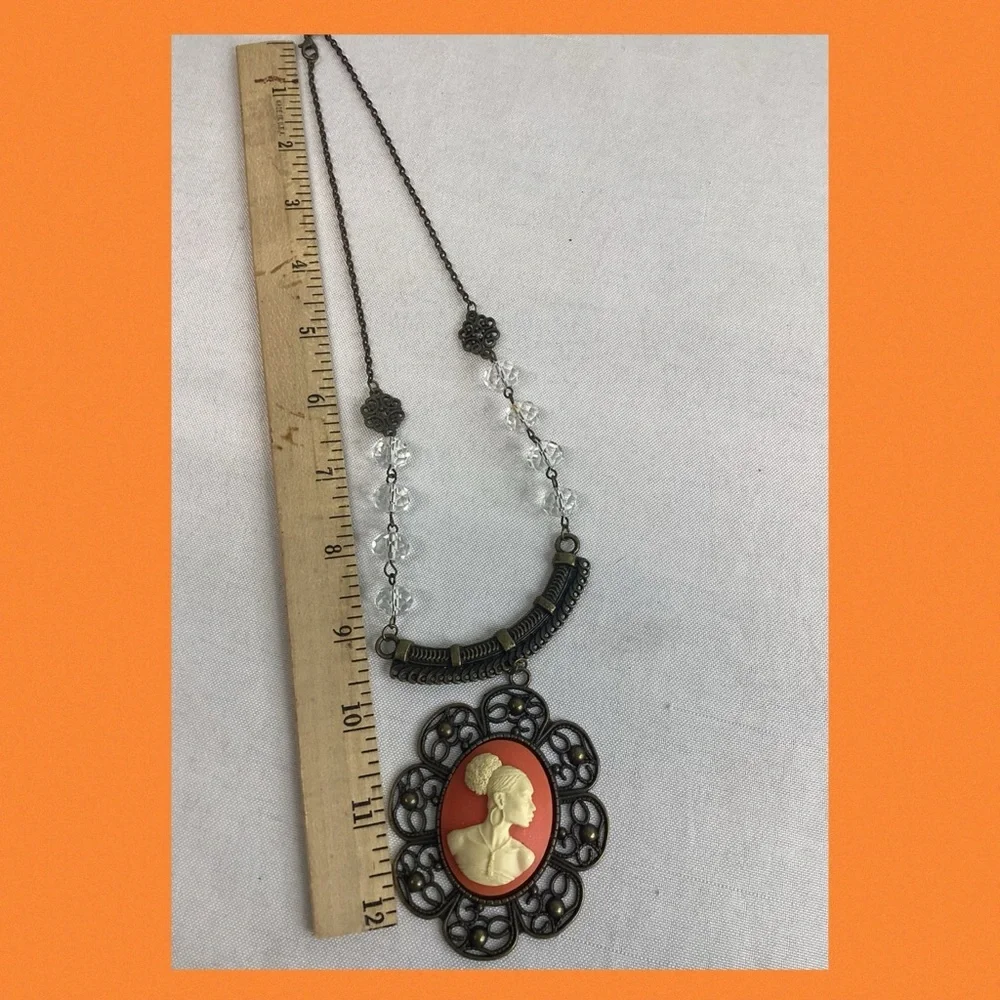 Orange and bronze cameo necklace.